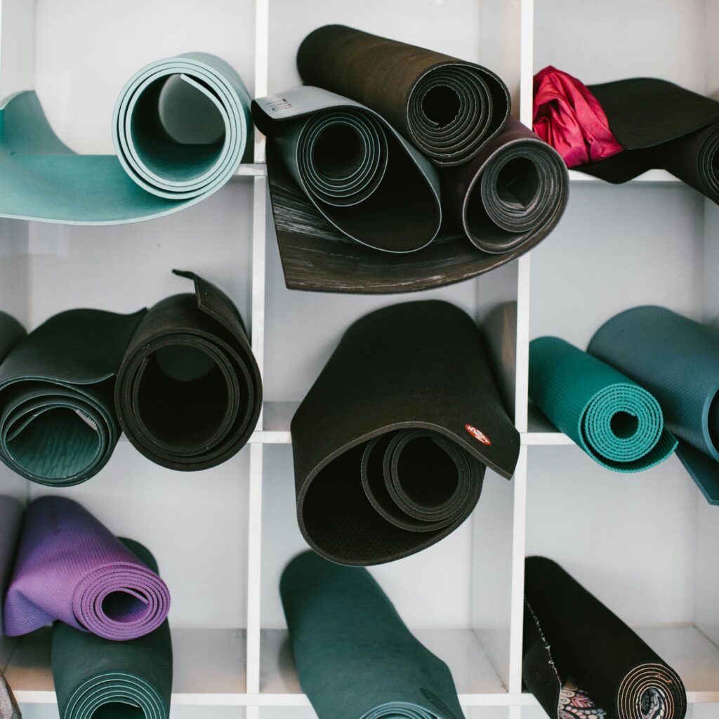 Colorful array of rolled yoga mats